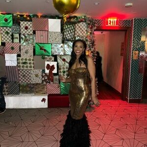 Gold Sequin Gown with Black Feather Hem